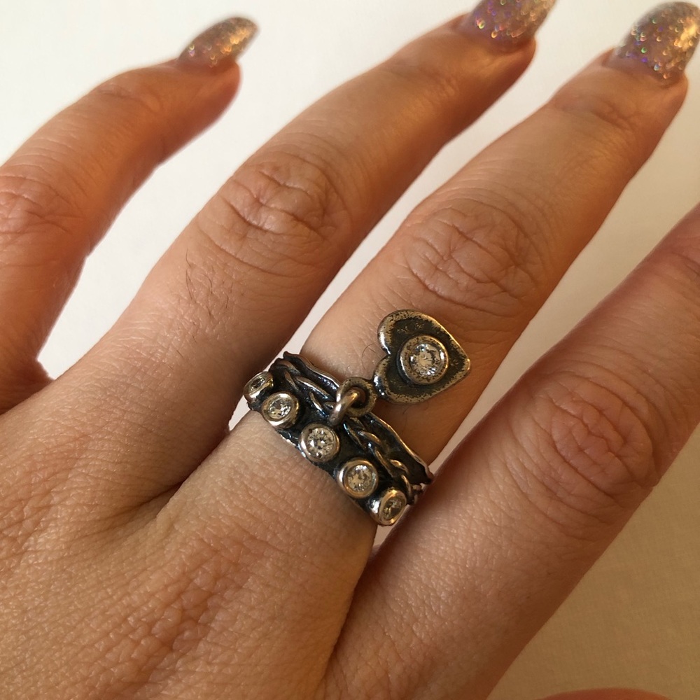 Solid sterling silver ring with head charm